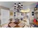 Charming dining area with a round table and ornate chandelier at 3425 S Atlantic Ave # 1105, Daytona Beach Shores, FL 32118