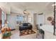 Relaxing sitting area with a comfortable couch and ceiling fan at 3425 S Atlantic Ave # 1105, Daytona Beach Shores, FL 32118
