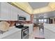 Modern kitchen with stainless steel appliances and stylish backsplash at 3425 S Atlantic Ave # 1105, Daytona Beach Shores, FL 32118