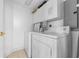 Stackable washer and dryer in a small laundry room at 3425 S Atlantic Ave # 1105, Daytona Beach Shores, FL 32118