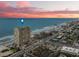 Aerial view of beachfront high-rise building at sunset at 3425 S Atlantic Ave # 1105, Daytona Beach Shores, FL 32118