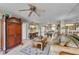 Living room with antique wooden furniture and a ceiling fan at 3425 S Atlantic Ave # 1105, Daytona Beach Shores, FL 32118