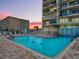 Inviting community pool with a relaxing atmosphere at 3425 S Atlantic Ave # 1105, Daytona Beach Shores, FL 32118