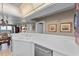 Kitchen boasts white cabinets, modern appliances, and a breakfast bar at 3425 S Atlantic Ave # 1105, Daytona Beach Shores, FL 32118