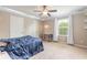 Comfortable bedroom with ceiling fan and ample closet space at 206 Laurel Point Ct, Deland, FL 32724