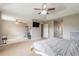Main bedroom with adjoining home gym and ceiling fan at 206 Laurel Point Ct, Deland, FL 32724