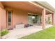 Covered patio with sliding glass doors and backyard access at 206 Laurel Point Ct, Deland, FL 32724