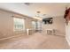 Large bonus room with two workspaces and carpeted flooring at 206 Laurel Point Ct, Deland, FL 32724