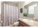 Clean bathroom with shower/tub combo and updated vanity at 206 Laurel Point Ct, Deland, FL 32724