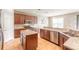 Spacious kitchen with granite countertops, stainless steel appliances, and an island at 206 Laurel Point Ct, Deland, FL 32724