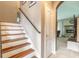 Staircase with wood and white risers at 206 Laurel Point Ct, Deland, FL 32724