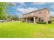 Two-story house with covered patio and grassy backyard at 206 Laurel Point Ct, Deland, FL 32724
