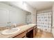 Bathroom with double sinks, shower/tub combo and updated vanity at 206 Laurel Point Ct, Deland, FL 32724