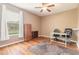 Bright home office features wood flooring and ample natural light at 206 Laurel Point Ct, Deland, FL 32724