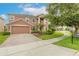 Two story house with brick driveway and landscaped yard at 206 Laurel Point Ct, Deland, FL 32724