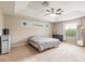 Large main bedroom with ceiling fan, carpeted floor and large window at 206 Laurel Point Ct, Deland, FL 32724
