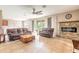 Spacious living room featuring a fireplace and comfortable leather seating at 206 Laurel Point Ct, Deland, FL 32724