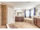 Primary bathroom with soaking tub, double vanity and large shower at 206 Laurel Point Ct, Deland, FL 32724