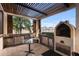 Modern outdoor kitchen with grill and covered patio area at 2273 Grayling St, Orlando, FL 32820
