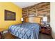 Spacious bedroom with wood-look accent wall and plush bedding at 2273 Grayling St, Orlando, FL 32820