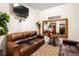 Relaxing sitting area featuring leather sofas and large mirror at 2273 Grayling St, Orlando, FL 32820