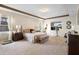 Luxurious main bedroom featuring a king-size bed and access to a private bath at 2273 Grayling St, Orlando, FL 32820