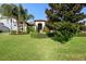 House with lush landscaping and palm trees at 2273 Grayling St, Orlando, FL 32820