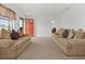 Spacious living room with neutral color palette, carpet flooring, and ample natural light at 133 Cardinal Dr, Ormond Beach, FL 32176