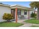 Home features a covered patio with seating, providing an outdoor space for relaxation at 133 Cardinal Dr, Ormond Beach, FL 32176