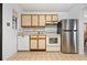 Efficient kitchen with ample cabinetry, stainless steel refrigerator, and dishwasher at 133 Cardinal Dr, Ormond Beach, FL 32176