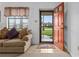 Entryway with tiled floor and view into the living room from the front door at 133 Cardinal Dr, Ormond Beach, FL 32176