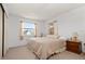 Bright bedroom with a double bed and wooden nightstand at 133 Cardinal Dr, Ormond Beach, FL 32176