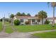 House exterior with carport and palm trees at 133 Cardinal Dr, Ormond Beach, FL 32176