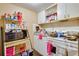 Small kitchen with stove, microwave, and various kitchen supplies at 432 Marion St, Daytona Beach, FL 32114
