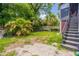 Backyard with grass, trees, and storage at 432 Marion St, Daytona Beach, FL 32114