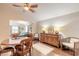 Bright dining room featuring hardwood floors and a wooden buffet at 4088 Clock Tower Dr, Port Orange, FL 32129