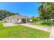 House exterior showcasing a carport and well-maintained landscaping at 4088 Clock Tower Dr, Port Orange, FL 32129