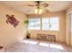 Sunroom with tile floors, ceiling fan, and access to outdoors at 4088 Clock Tower Dr, Port Orange, FL 32129