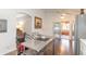 Open concept kitchen with stainless steel appliances and breakfast bar at 4088 Clock Tower Dr, Port Orange, FL 32129