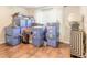 Room with multiple storage bins and hardwood floor at 4088 Clock Tower Dr, Port Orange, FL 32129