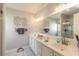 Double vanity bathroom with large mirror and walk-in shower at 4088 Clock Tower Dr, Port Orange, FL 32129