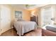 Cozy bedroom with double bed, dresser, and ample natural light at 4088 Clock Tower Dr, Port Orange, FL 32129