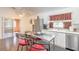 Bright kitchen with stainless steel appliances and access to a patio at 4088 Clock Tower Dr, Port Orange, FL 32129