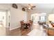 Charming dining room with hardwood floors and view into living room at 4088 Clock Tower Dr, Port Orange, FL 32129