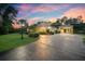 Evening view of single-Gathering home with carport and landscaped yard at 2075 Country Farms Rd, Port Orange, FL 32128