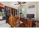 Spacious home office with built-in shelving and large desk at 2075 Country Farms Rd, Port Orange, FL 32128