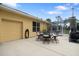 Relaxing patio area with fire pit near the pool and garage at 2075 Country Farms Rd, Port Orange, FL 32128