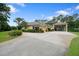 Side view of a house with a large covered boat storage area at 2075 Country Farms Rd, Port Orange, FL 32128