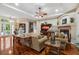 Open living room with hardwood floors, fireplace, and access to other areas at 2075 Country Farms Rd, Port Orange, FL 32128