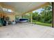 Covered patio storing a boat on a trailer at 2075 Country Farms Rd, Port Orange, FL 32128